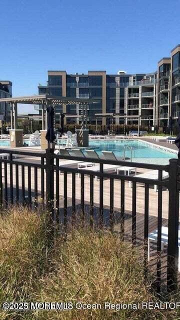 30 Melrose Terrace, Unit 303 Long Branch, NJ 07740 - Photo 30 of 54 a balcony with table and chairs
