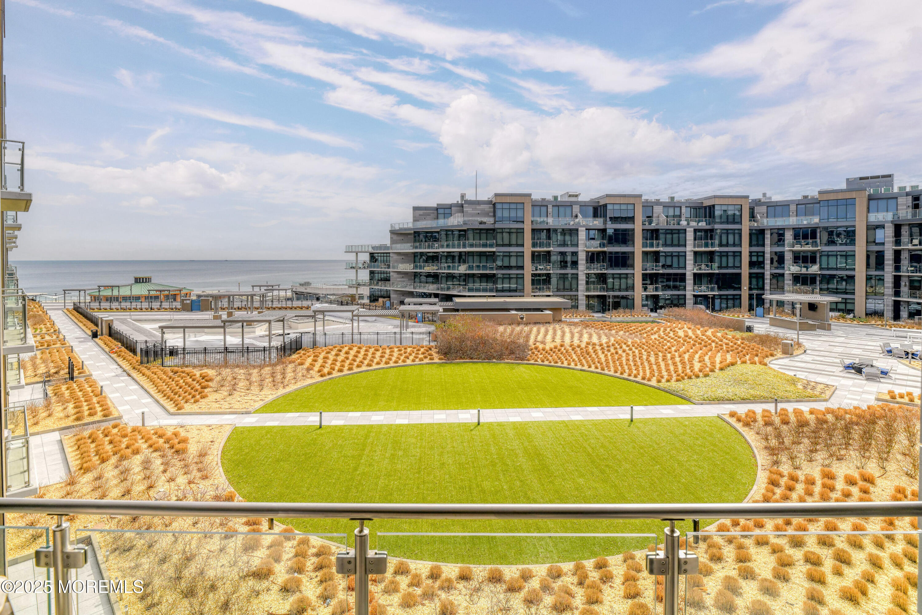 30 Melrose Terrace, Unit 303 Long Branch, NJ 07740 - Photo 36 of 54 a view of a swimming pool with a lounge chair