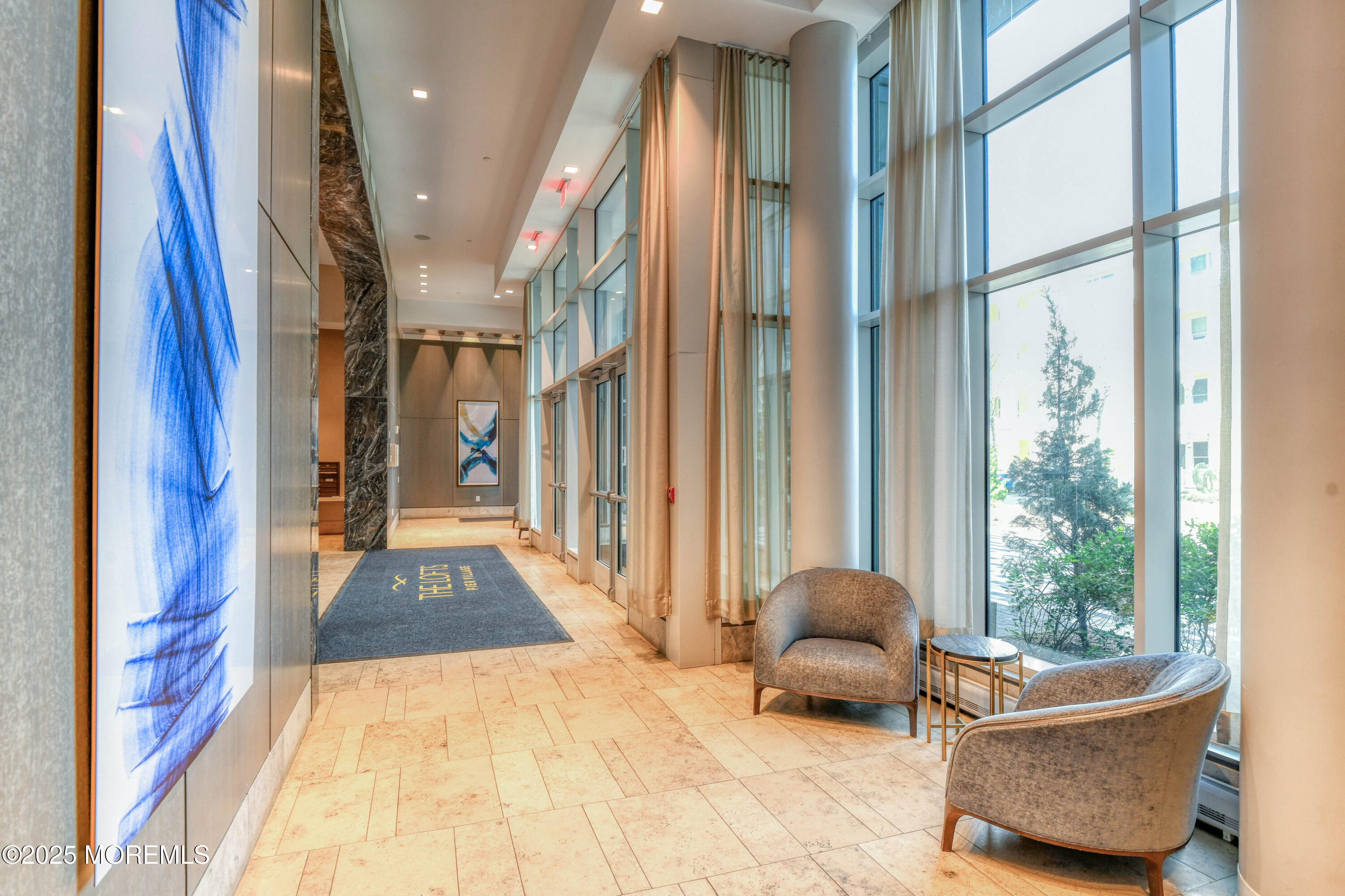 30 Melrose Terrace, Unit 303 Long Branch, NJ 07740 - Photo 6 of 54 a living room with furniture and a large window