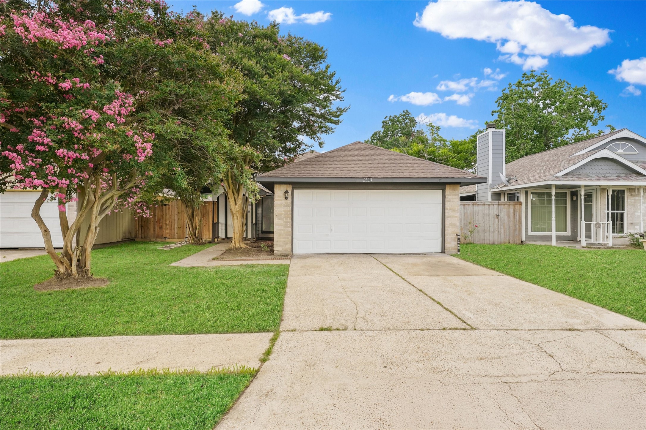 23311 Pebworth Place Spring, TX 77373 - Photo 24 of 24 a front view of a house with a garden