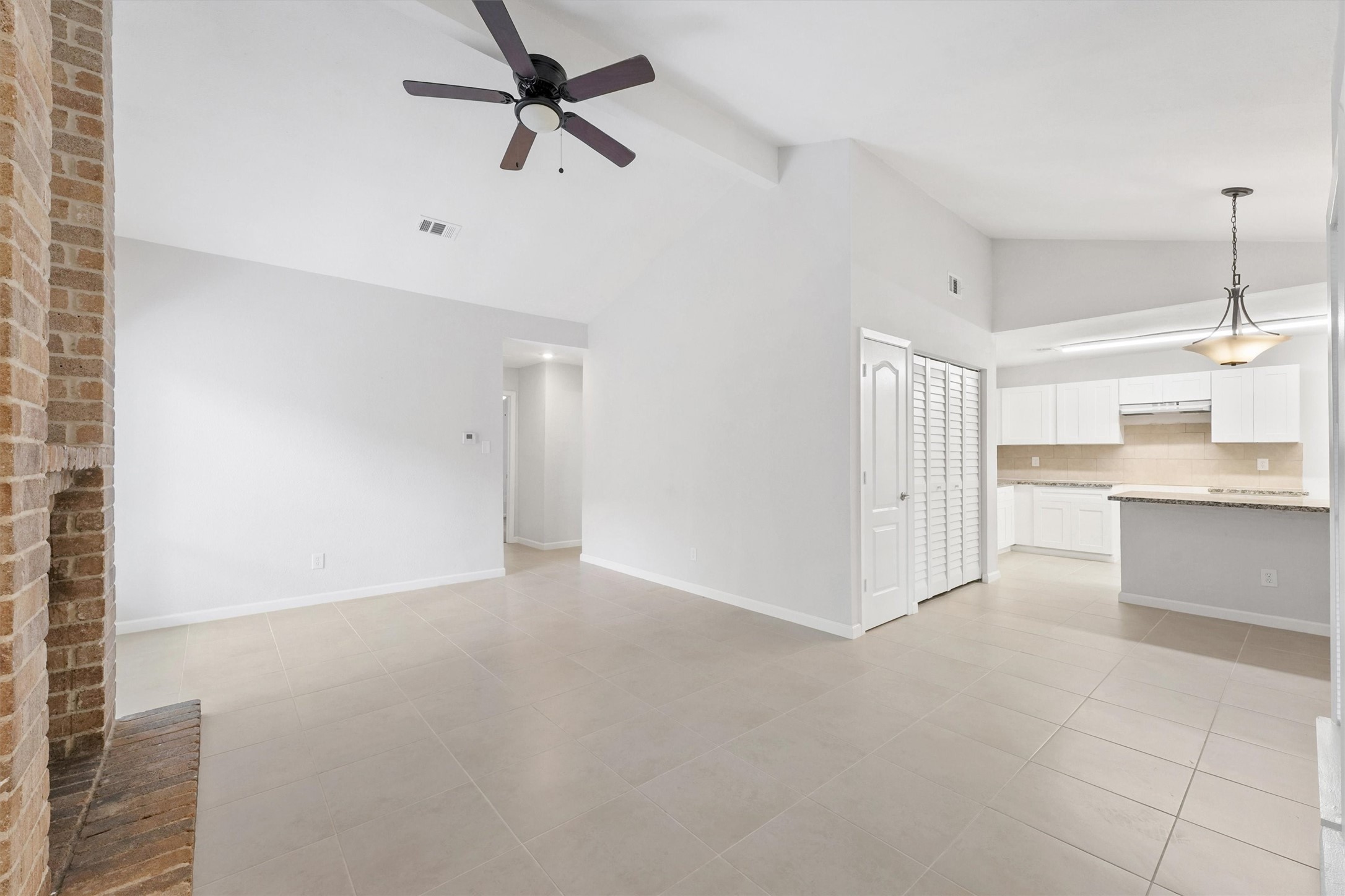 23311 Pebworth Place Spring, TX 77373 - Photo 5 of 24 a view of a kitchen with an empty space and a sink