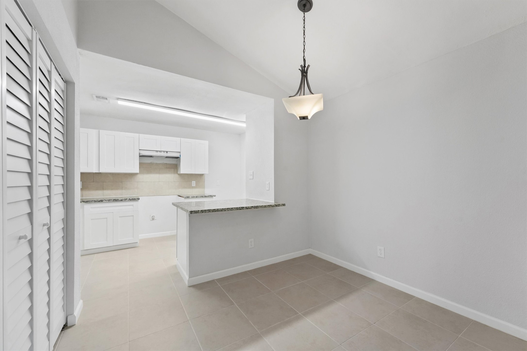 23311 Pebworth Place Spring, TX 77373 - Photo 7 of 24 a kitchen with white cabinets and appliances