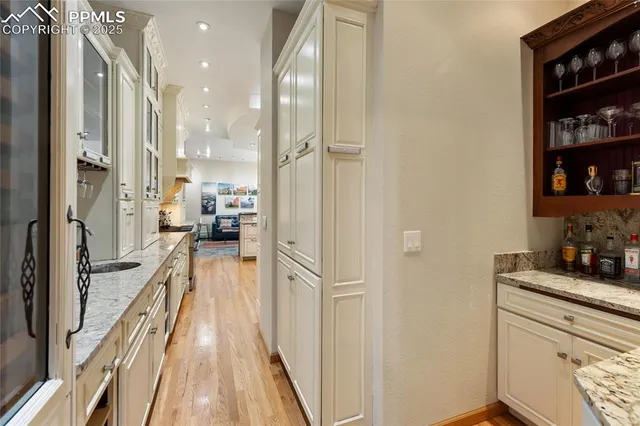 a view of a kitchen from the hallway
