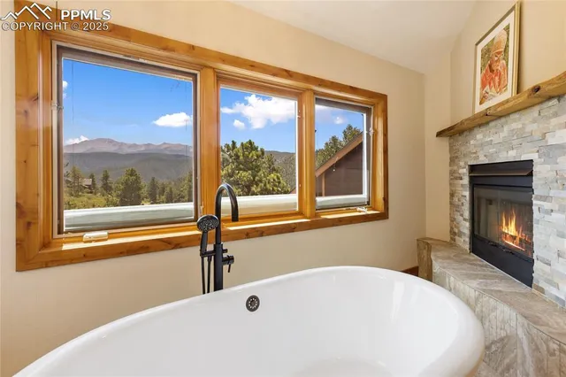 a white bath tub sitting next to a window
