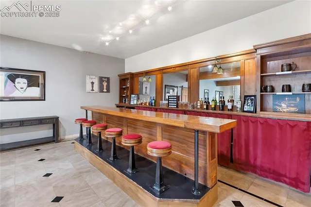 a living room with furniture a rug and a table