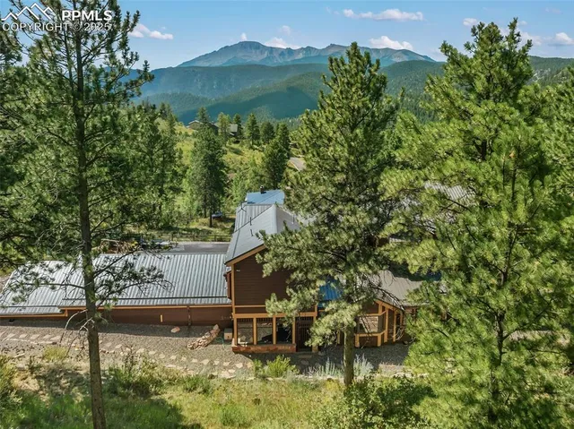 a backyard of a house with yard and outdoor seating