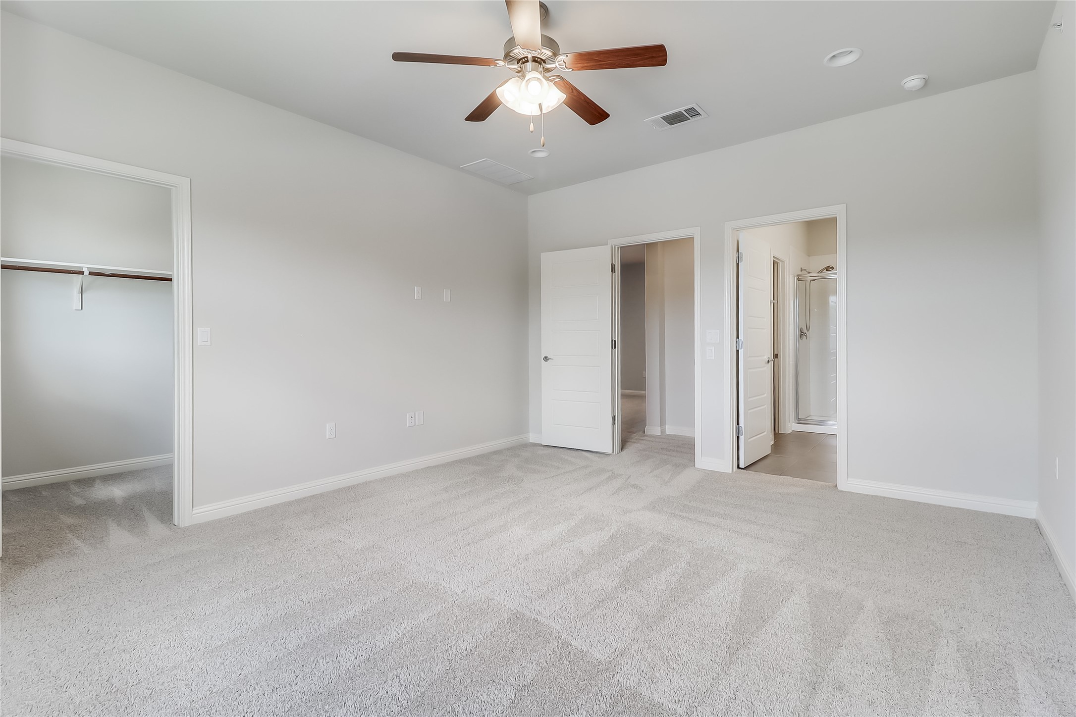 6814 East Riverside Drive, Unit 32 Austin, TX 78741 - Photo 12 of 26 an empty room with closet and a ceiling fan