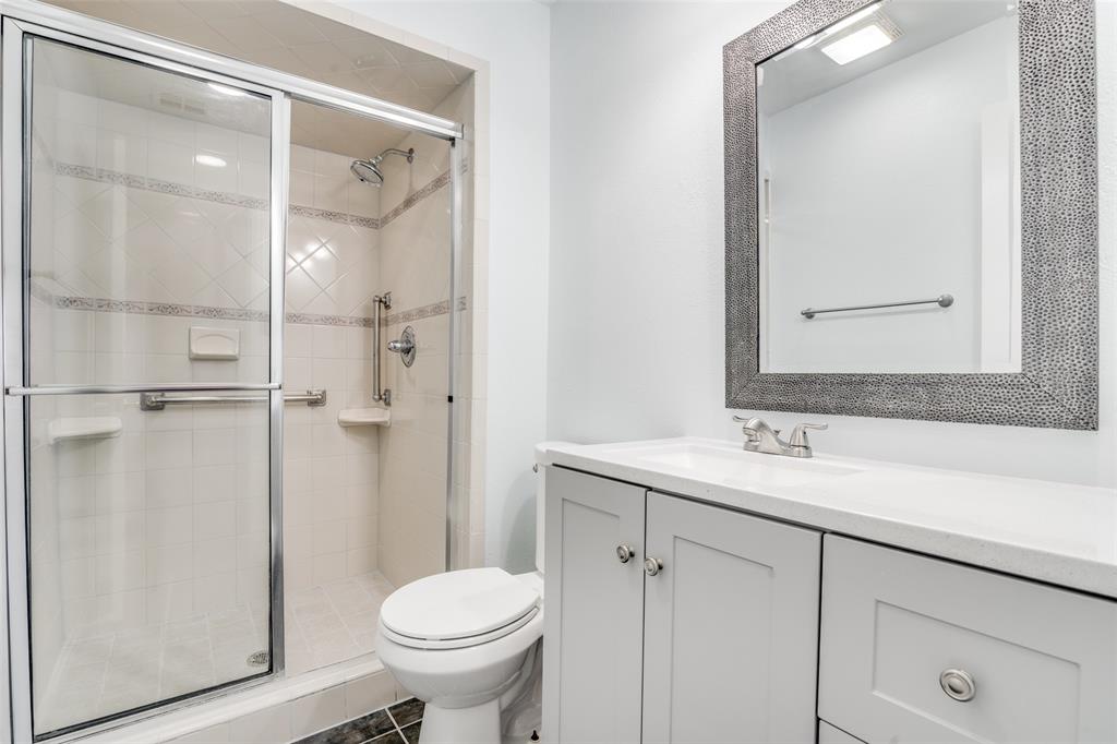 5602 Magnolia Lane Rowlett, TX 75089 - Photo 13 of 24 a bathroom with a sink toilet and shower