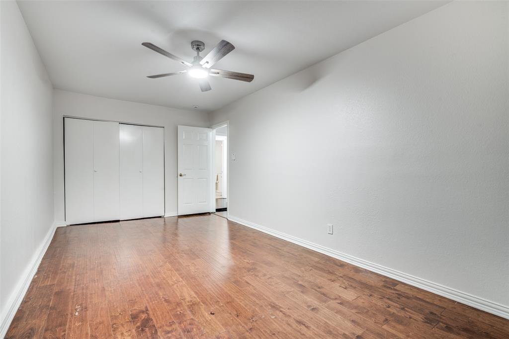 5602 Magnolia Lane Rowlett, TX 75089 - Photo 17 of 24 a view of an empty room with wooden floor
