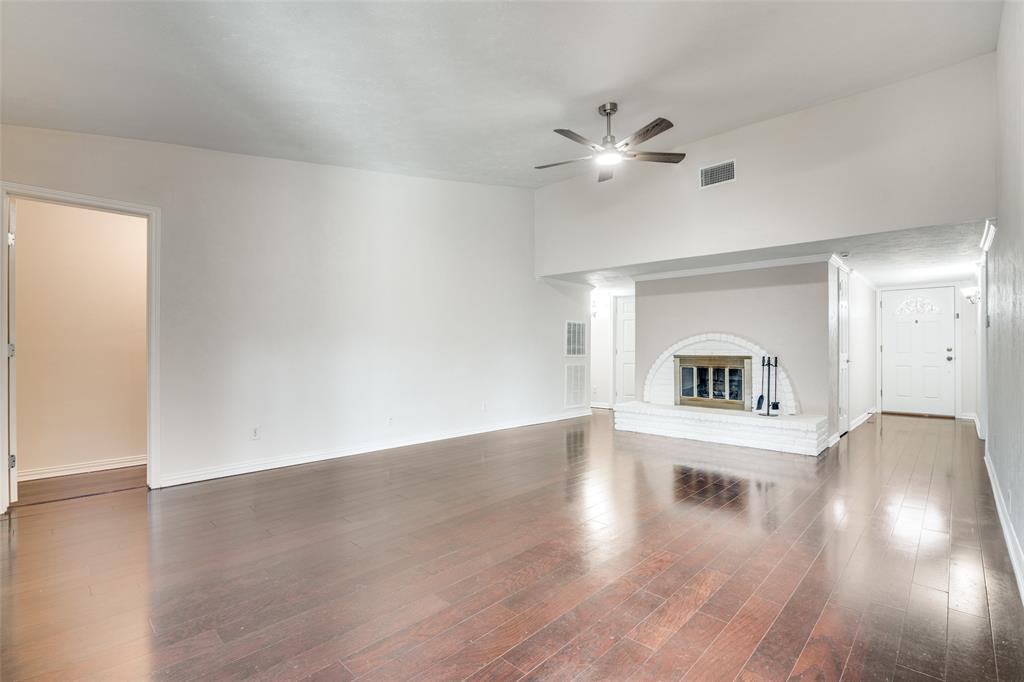 5602 Magnolia Lane Rowlett, TX 75089 - Photo 2 of 24 a view of empty room with wooden floor and fan