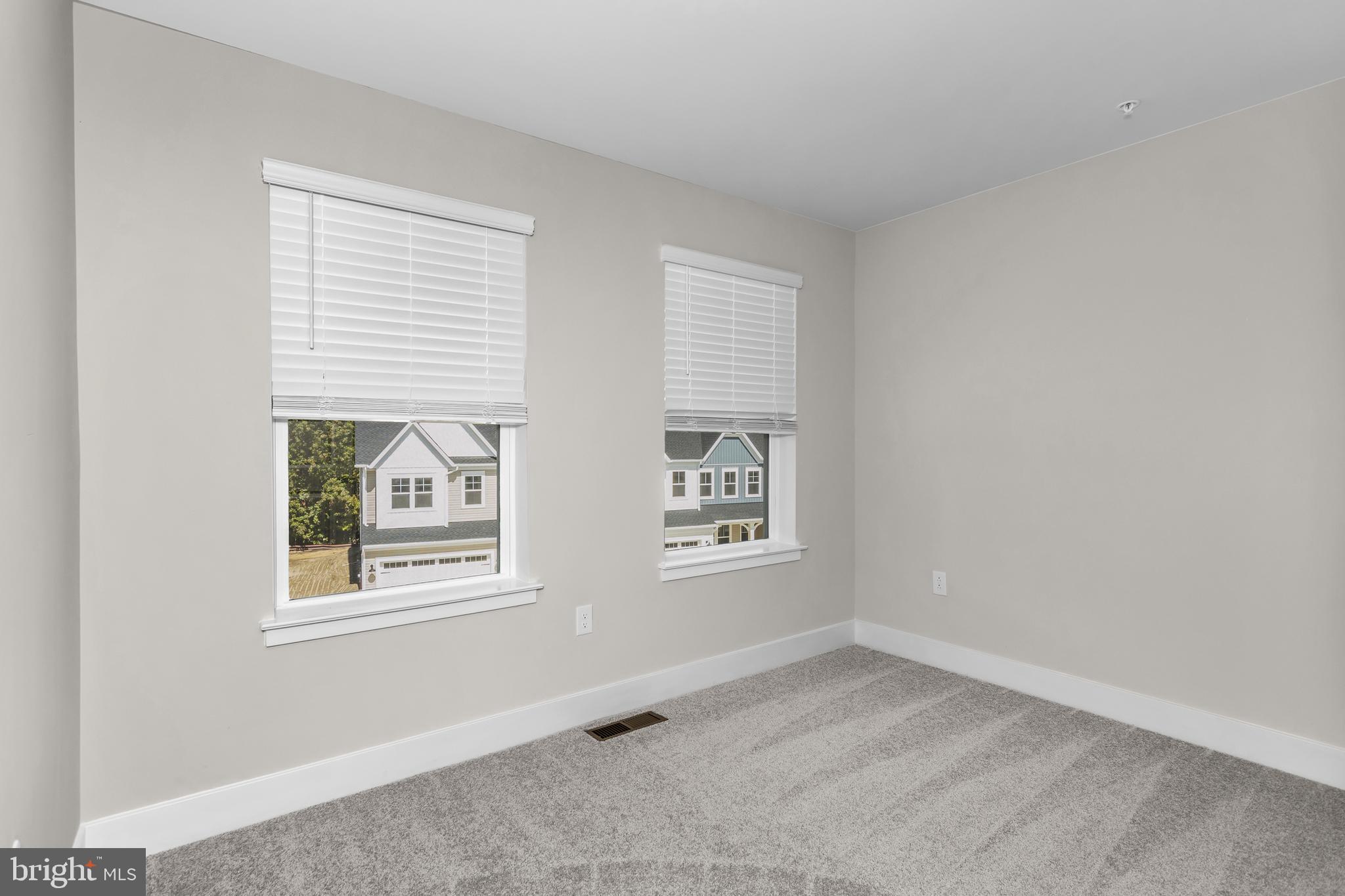 2110 Winterberry Lane Cambridge, MD 21613 - Photo 22 of 46 an empty room with windows