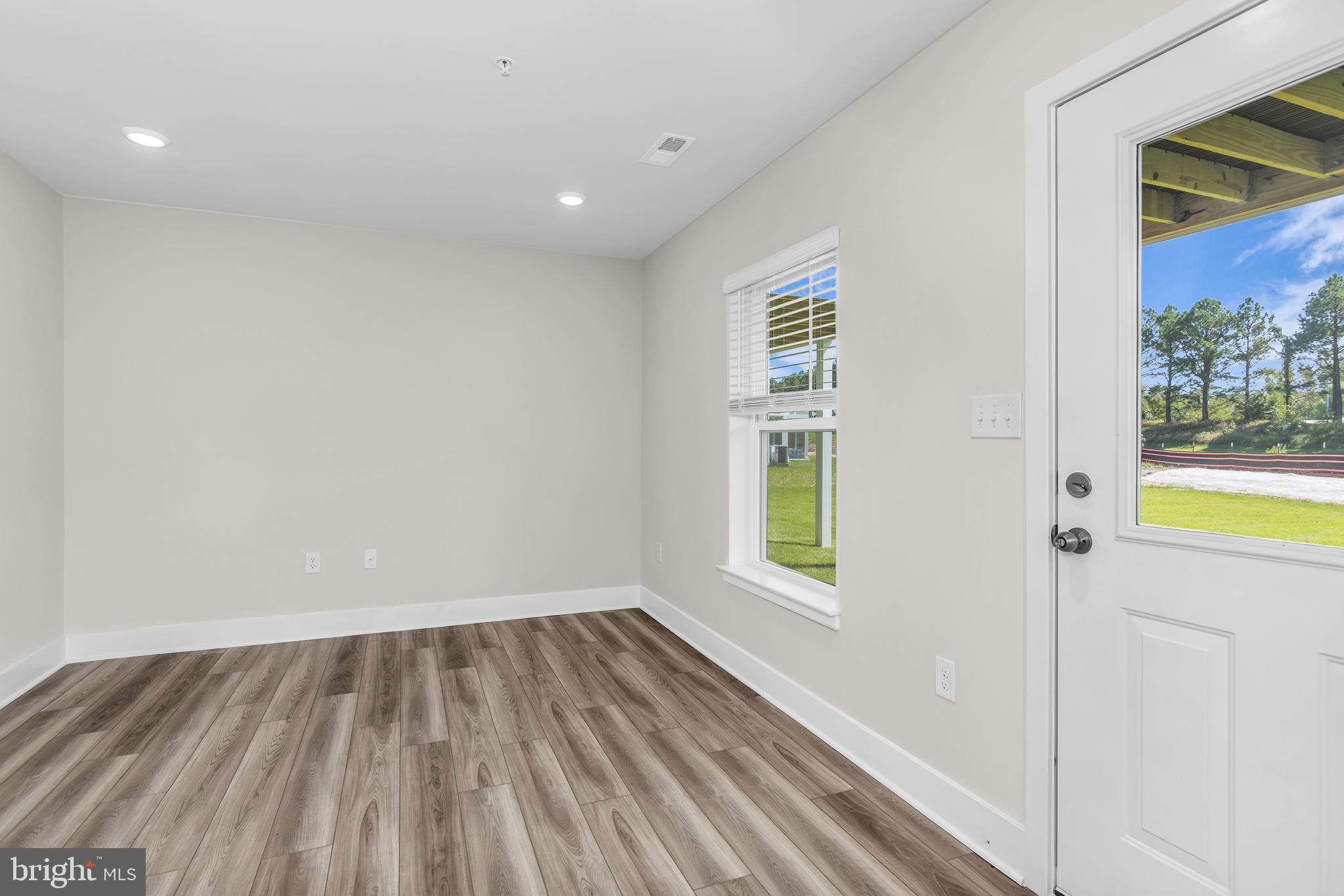 2110 Winterberry Lane Cambridge, MD 21613 - Photo 26 of 46 a view of a room with wooden floor and a window