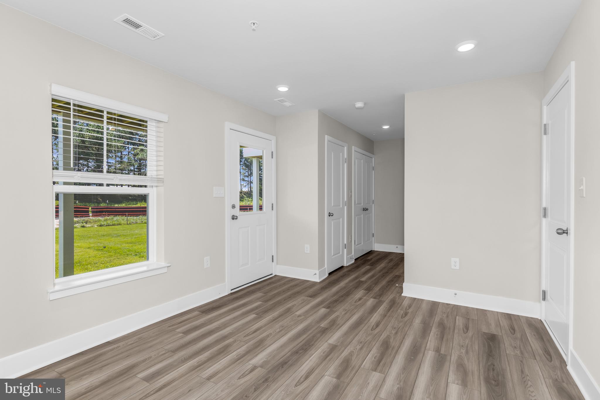 2110 Winterberry Lane Cambridge, MD 21613 - Photo 27 of 46 a view of wooden floor and windows in a room