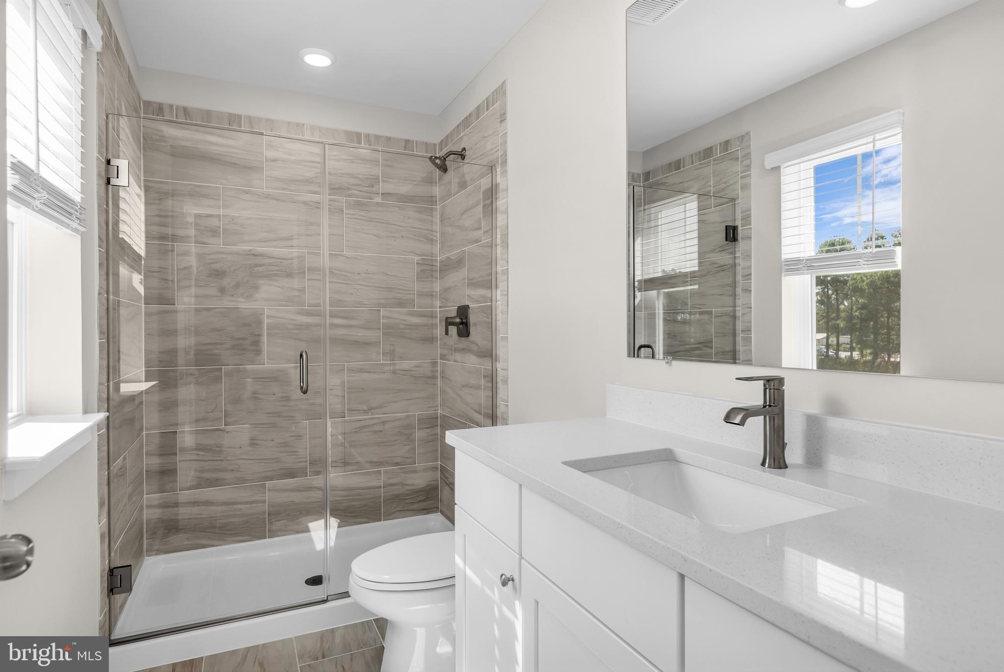 2110 Winterberry Lane Cambridge, MD 21613 - Photo 34 of 46 a bathroom with a sink a toilet and shower