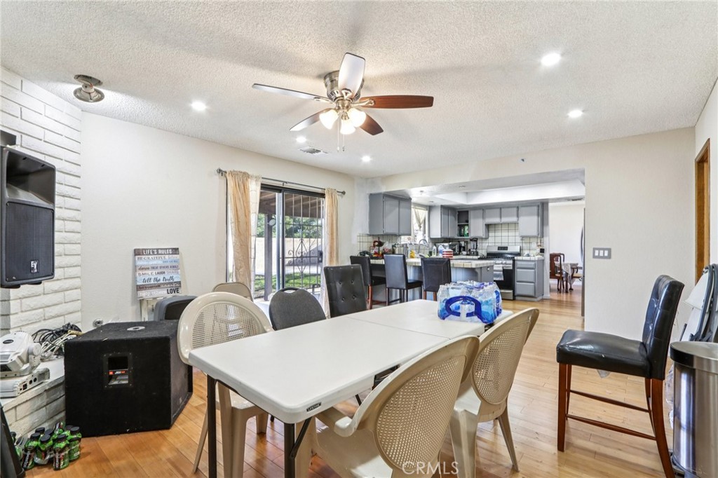 14057 Crow Road Apple Valley, CA 92307 - Photo 12 of 33 a view of a dining room with furniture and a window