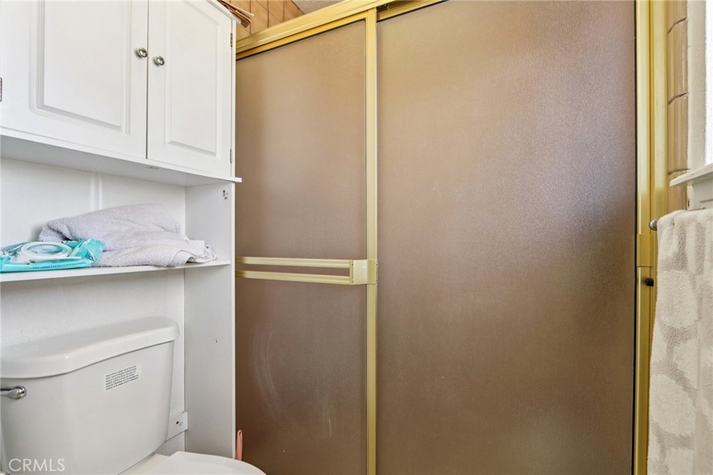 14057 Crow Road Apple Valley, CA 92307 - Photo 21 of 33 a bathroom with a shower and vanity