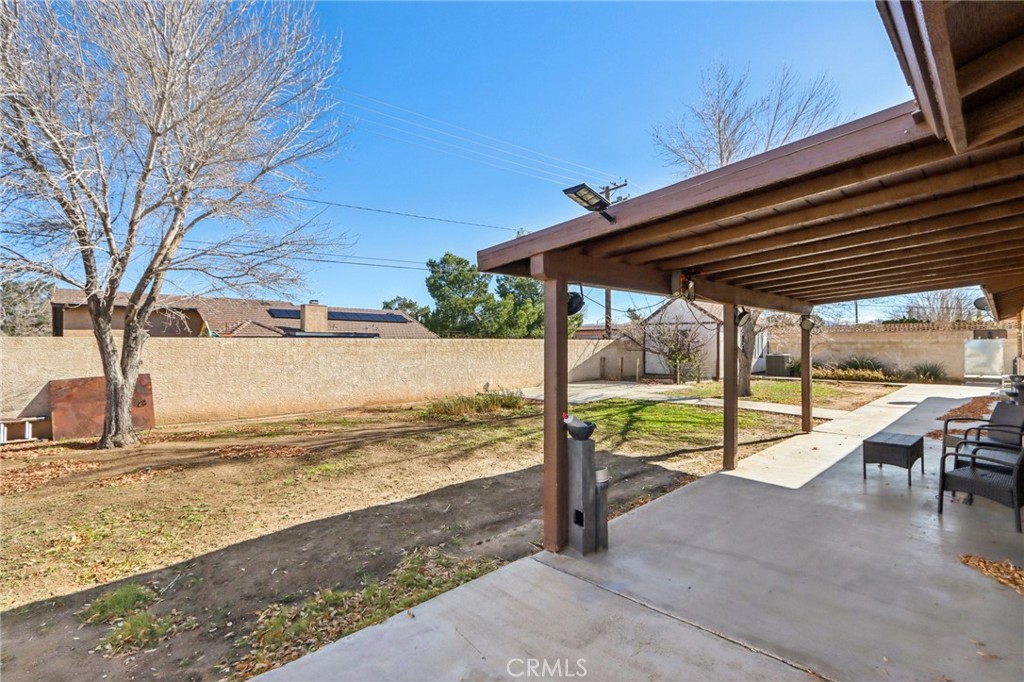 14057 Crow Road Apple Valley, CA 92307 - Photo 27 of 33 a view of a swimming pool with a patio