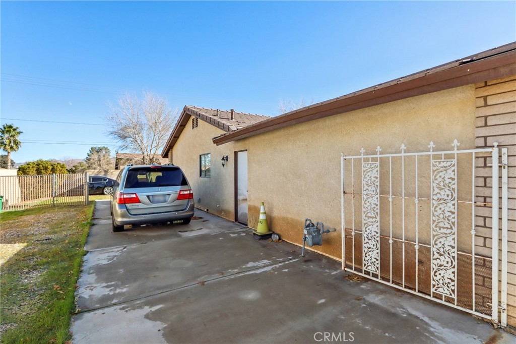 14057 Crow Road Apple Valley, CA 92307 - Photo 30 of 33 a view of a car park in front of house