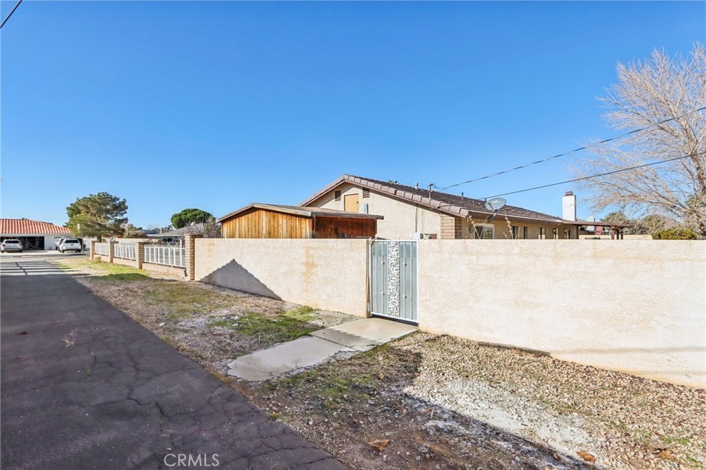 14057 Crow Road Apple Valley, CA 92307 - Photo 32 of 33 a view of a backyard of the house
