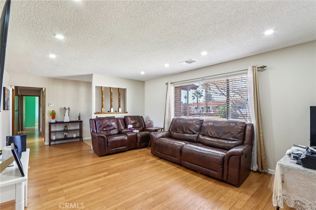 14057 Crow Road Apple Valley, CA 92307 - Photo 7 of 33 a living room with furniture window and wooden floor