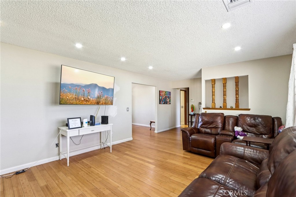 14057 Crow Road Apple Valley, CA 92307 - Photo 8 of 33 a living room with furniture and a flat screen tv