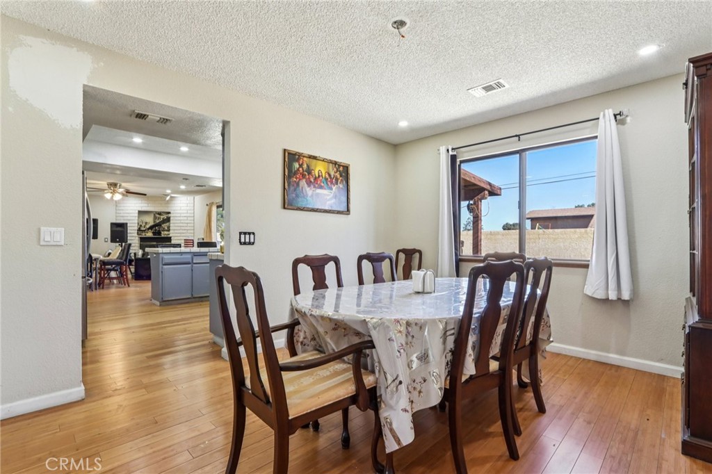 14057 Crow Road Apple Valley, CA 92307 - Photo 9 of 33 a view of a dining room with furniture
