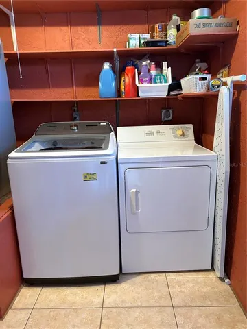 a utility room with washer and dryer