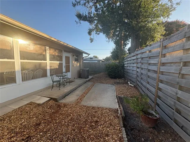 a view of a backyard with sitting area