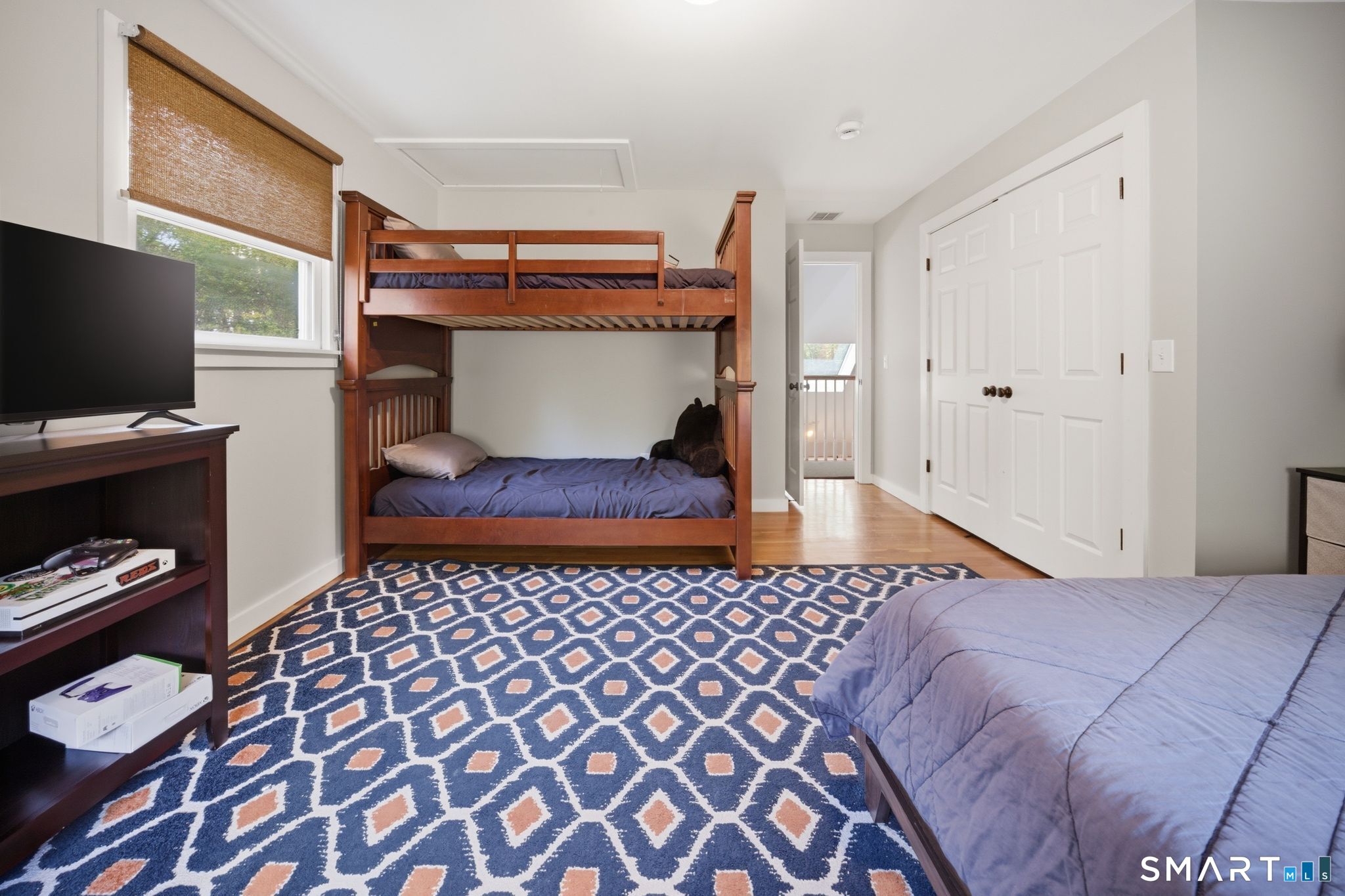 174 Walnut Hill Road Hartland, CT 06027 - Photo 27 of 36 a bedroom with a bed and a flat screen tv