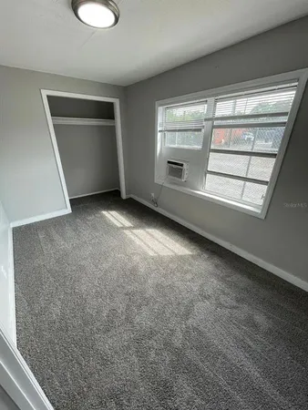 wooden floor in an empty room with a fireplace