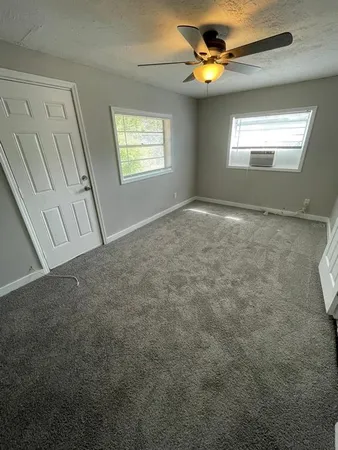 a view of an empty room with a window