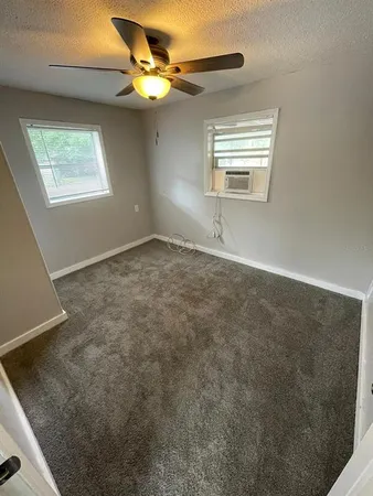a view of an empty room with a window