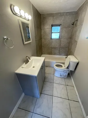 an aerial view of residential houses with outdoor space and swimming pool