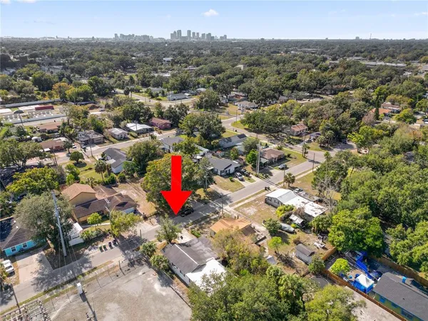 an aerial view of a house with a lake view