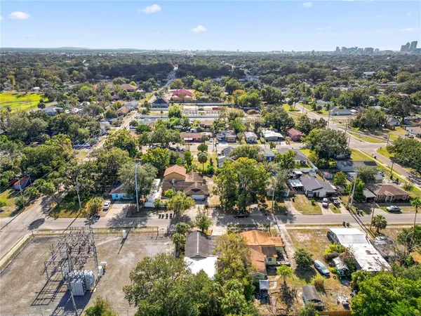 an aerial view of residential houses with outdoor space