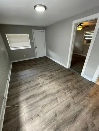 a view of a hallway view with wooden floor and staircase