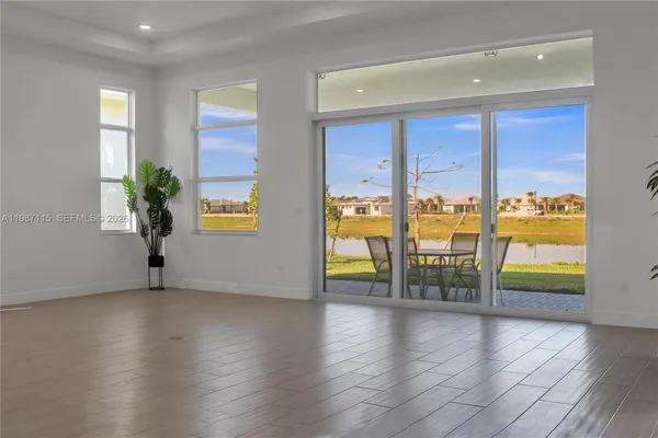a view of a entryway door and an empty room