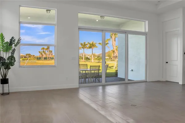 a kitchen with stainless steel appliances a refrigerator and a stove top oven