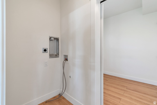 1820 West Farmhouse Flats Road Peoa, UT 84061 - Photo 72 of 79 Dedicated laundry area featuring a white wall finish, white baseboards, and wood-finish flooring