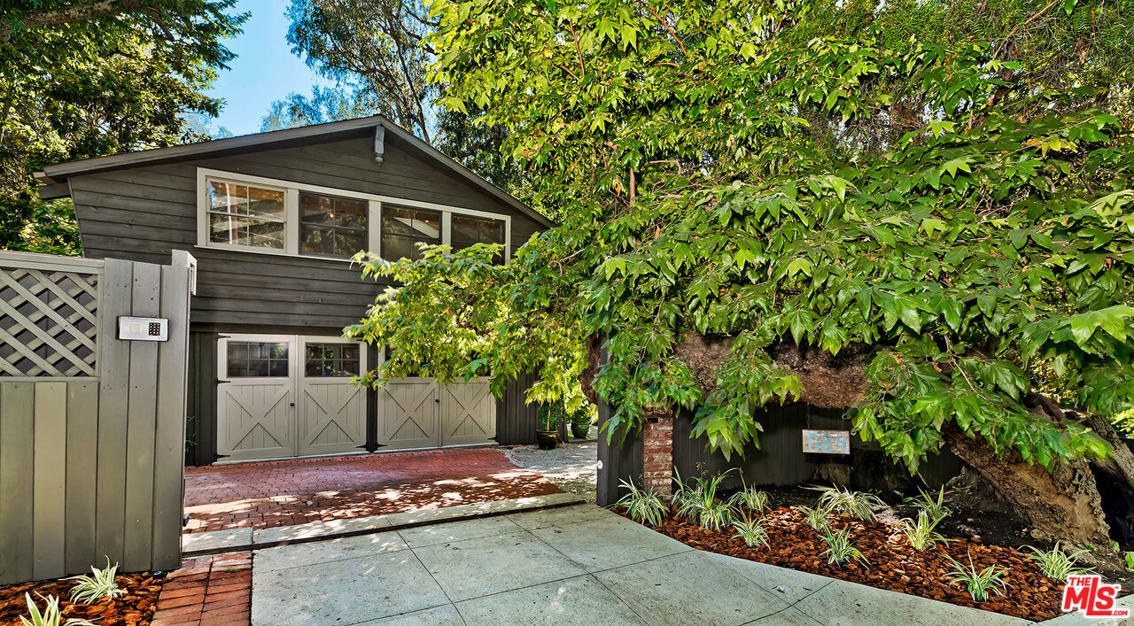 689 Brooktree Road Santa Monica, CA 90402 - Photo 2 of 32 a front view of a house with garden