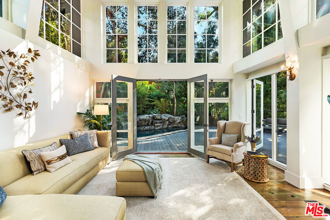 689 Brooktree Road Santa Monica, CA 90402 - Photo 11 of 32 a living room with furniture and a large window