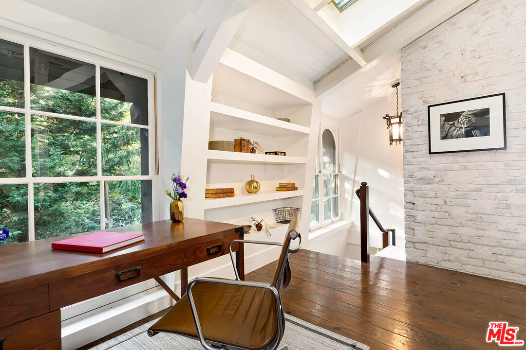 689 Brooktree Road Santa Monica, CA 90402 - Photo 24 of 32 a workspace with furniture window and wooden floor