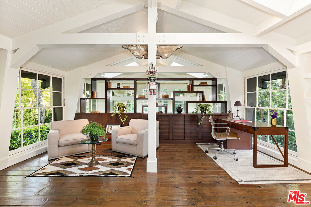 689 Brooktree Road Santa Monica, CA 90402 - Photo 26 of 32 a living room with fireplace furniture and a large window