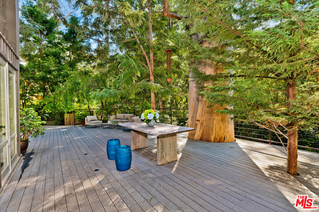 689 Brooktree Road Santa Monica, CA 90402 - Photo 4 of 32 a view of a deck with couches and wooden floor