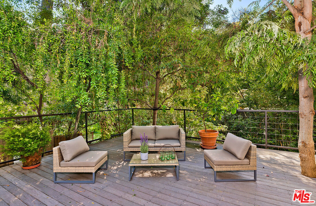689 Brooktree Road Santa Monica, CA 90402 - Photo 6 of 32 a view of a deck with couches and wooden floor