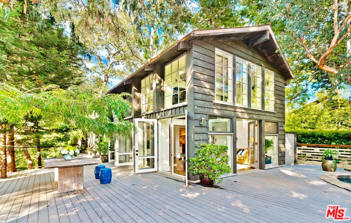 689 Brooktree Road Santa Monica, CA 90402 - Photo 8 of 32 a view of a house with a yard