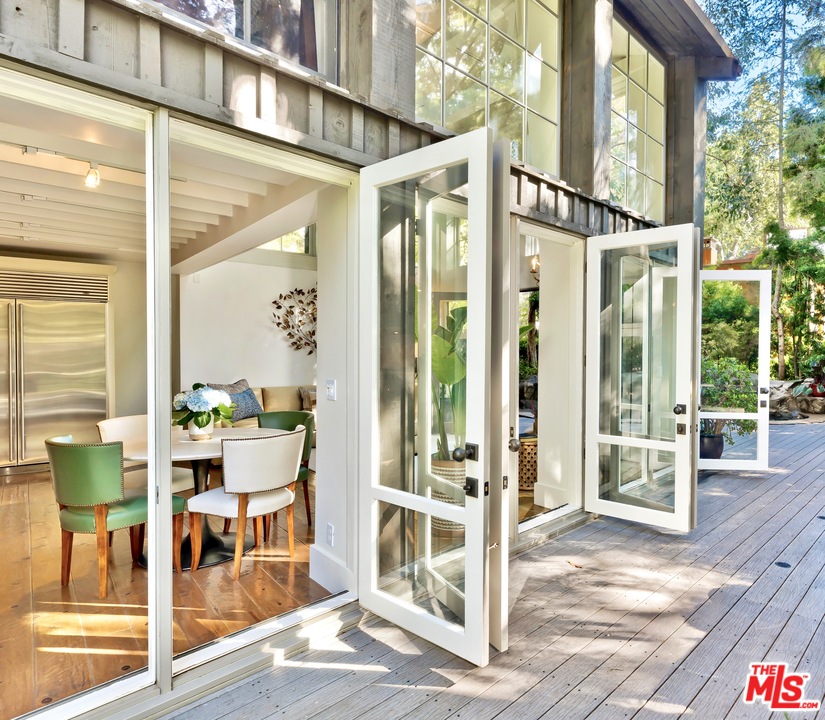 689 Brooktree Road Santa Monica, CA 90402 - Photo 9 of 32 a outdoor space with lots of chairs and a wooden floor