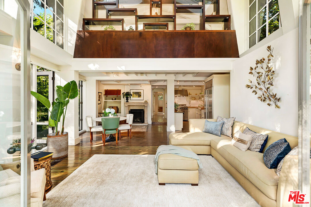 689 Brooktree Road Santa Monica, CA 90402 - Photo 10 of 32 a view of living room filled with furniture and floor to ceiling window