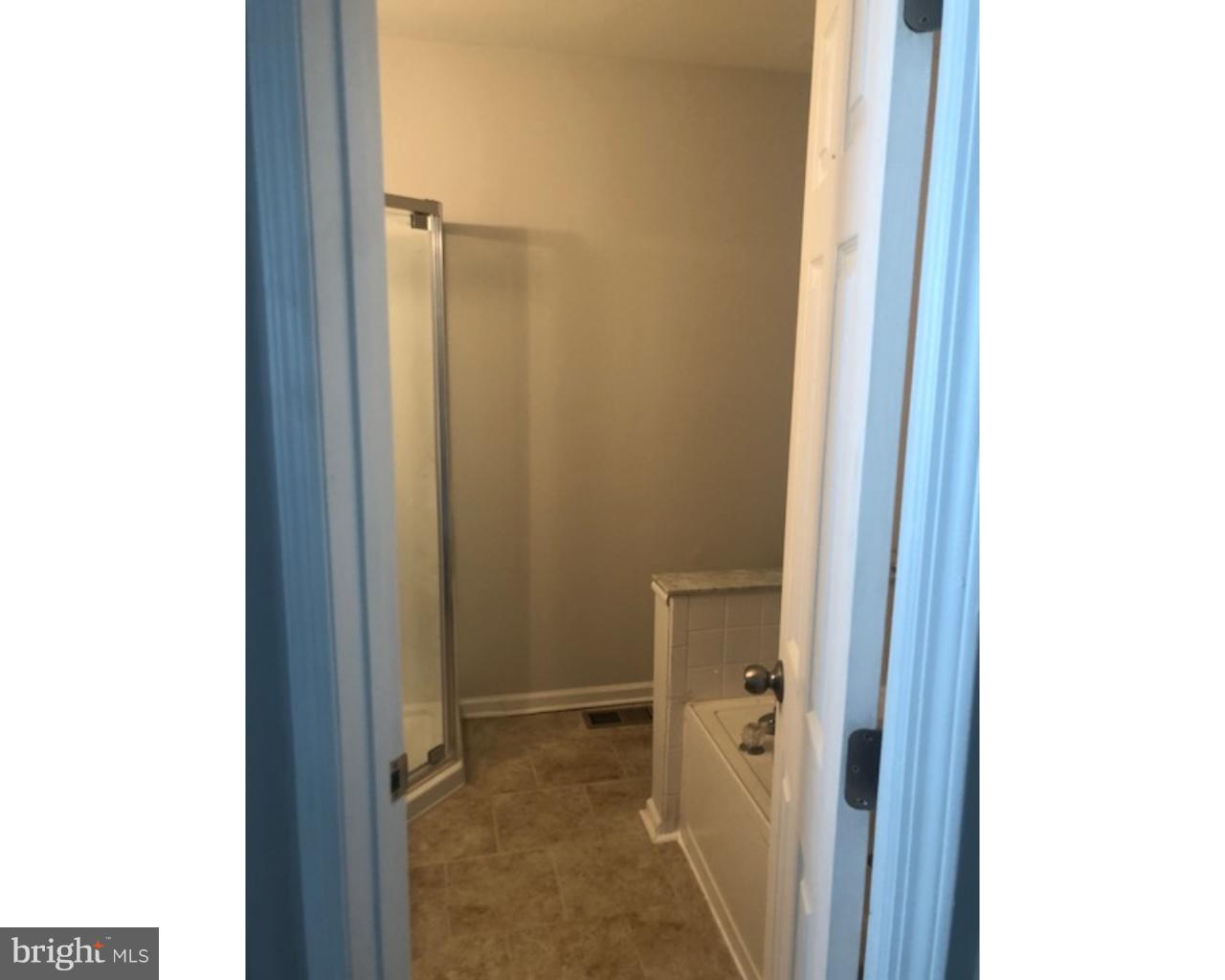 4 Sage Drive Lumberton, NJ 08048 - Photo 14 of 24 a bathroom with a shower and a door