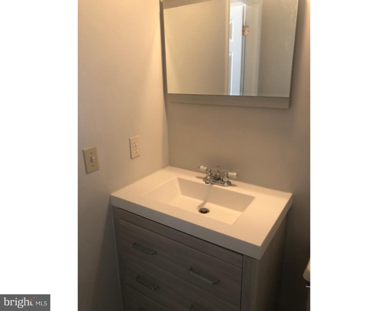 4 Sage Drive Lumberton, NJ 08048 - Photo 23 of 24 a bathroom with a sink and a mirror
